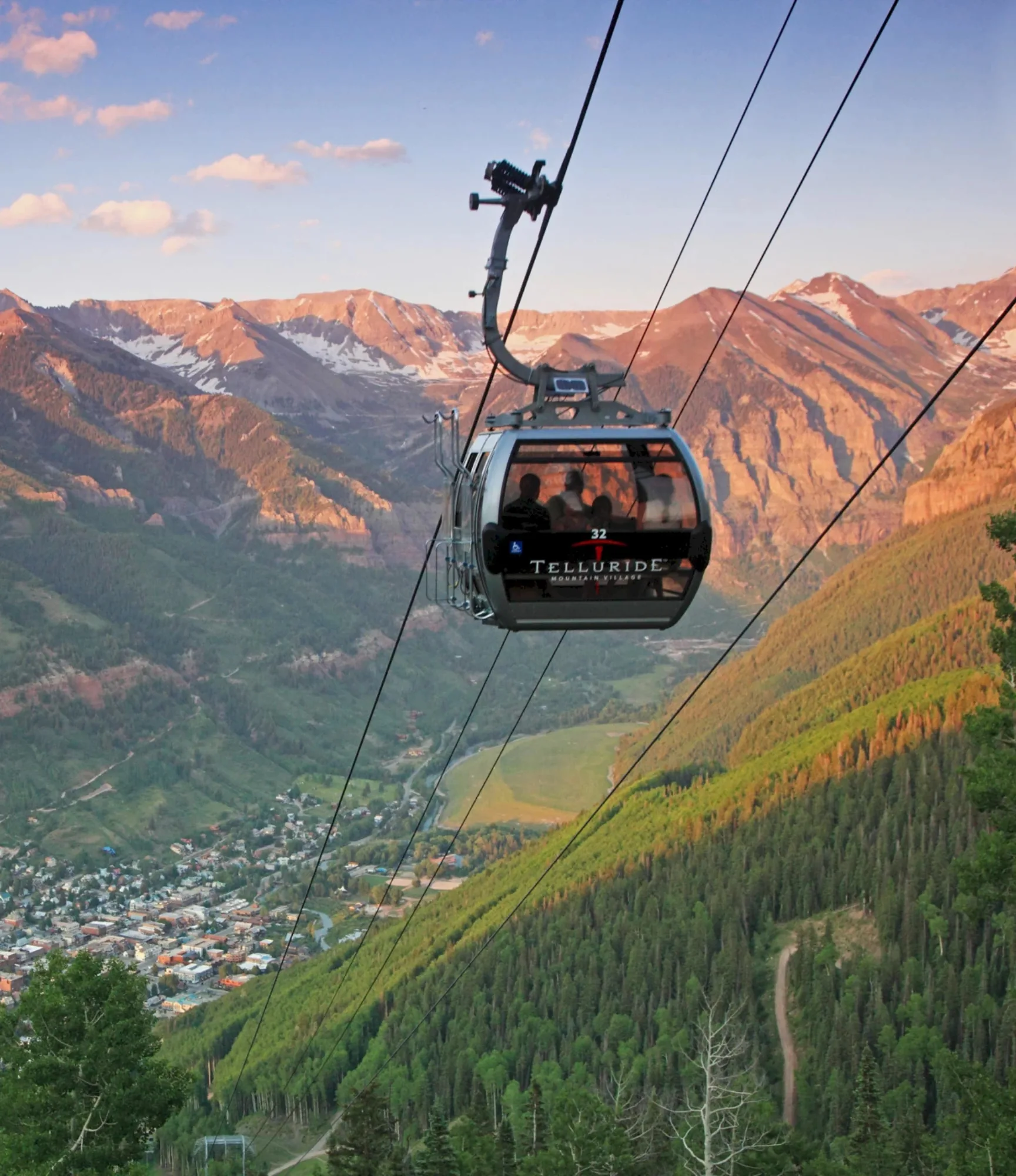 Telluride gondola over the valley at golden hour